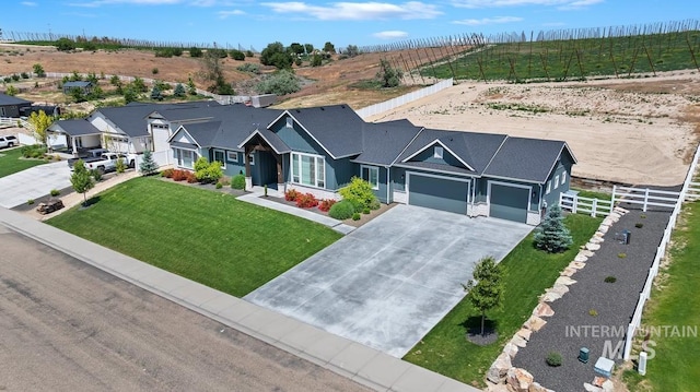 20150 Silver Spur Dr, Wilder, ID 83676 - view of front facade featuring driveway and an attached garage