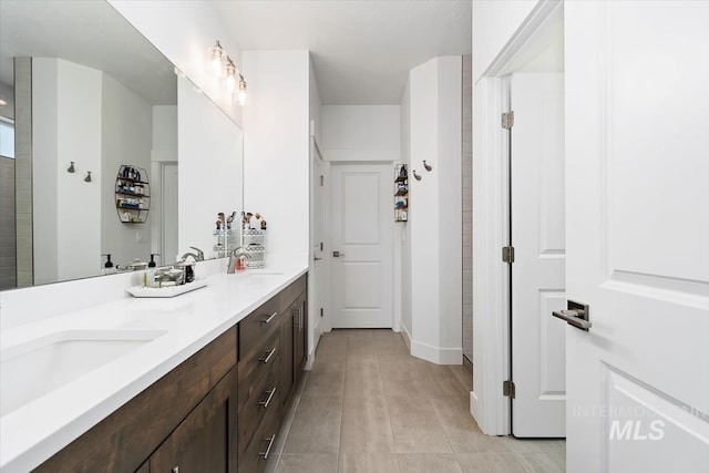 bathroom with double vanity and a sink