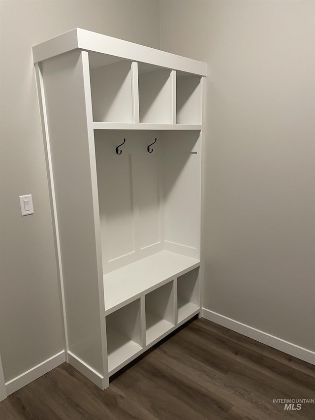 mudroom with baseboards and dark wood finished floors