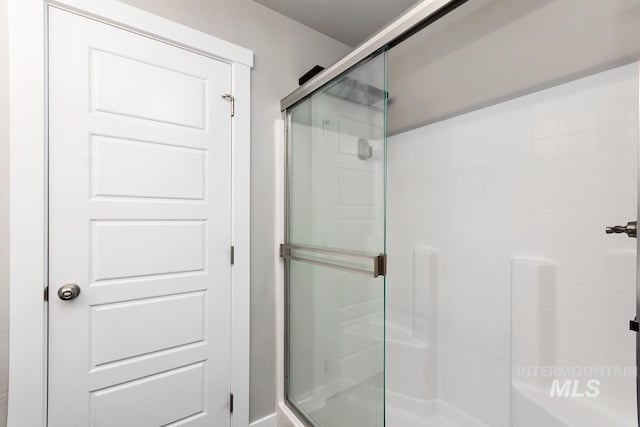 bathroom featuring an enclosed shower