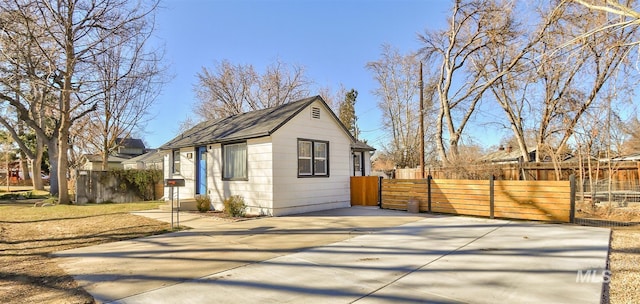 view of side of home with fence