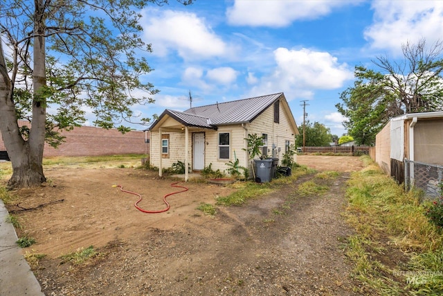9 E Owyhee Ave, Homedale, ID 83628 - view of front facade featuring fence, metal roof, and a standing seam roof