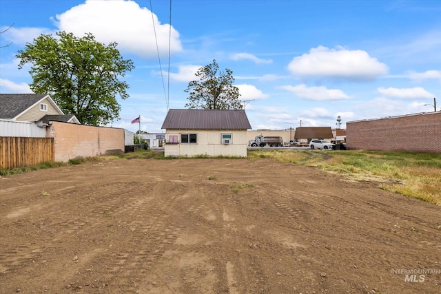 9 E Owyhee Ave, Homedale, ID 83628 - back of property with metal roof and fence