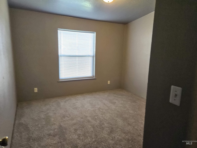 empty room with carpet flooring