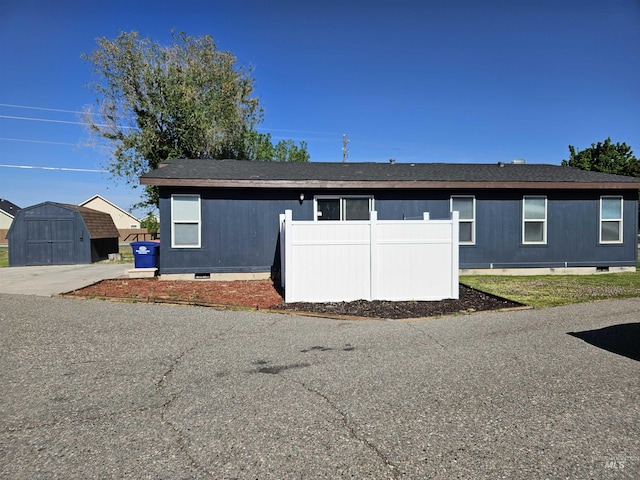 exterior space featuring a storage unit
