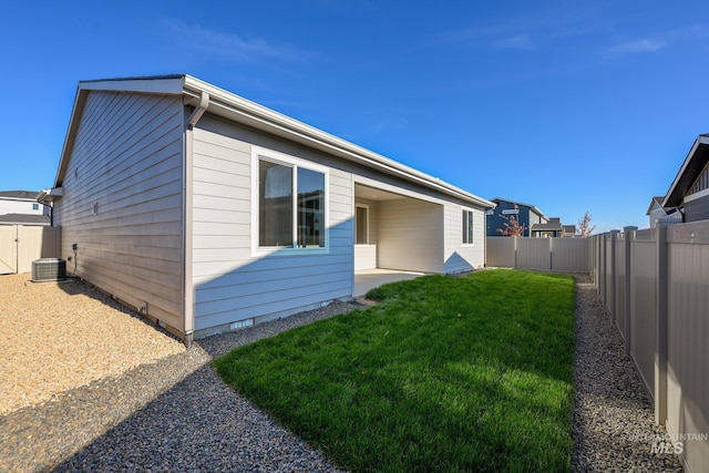 view of home's exterior featuring a lawn and cooling unit