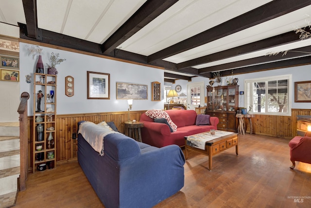 living room featuring beamed ceiling and hardwood / wood-style floors