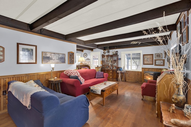 living room with beam ceiling and hardwood / wood-style floors