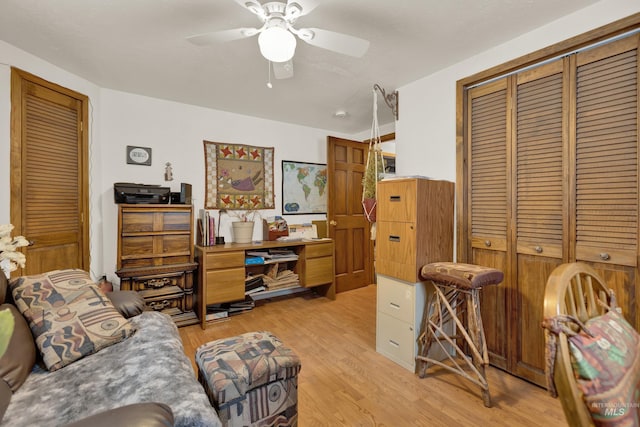 interior space with ceiling fan and light hardwood / wood-style floors