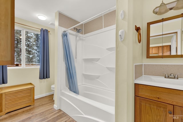 full bathroom featuring shower / bath combination with curtain, vanity, wood-type flooring, and toilet