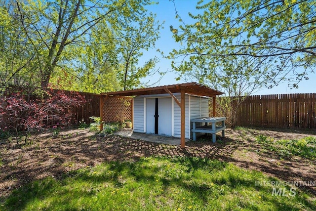 view of shed featuring a fenced backyard