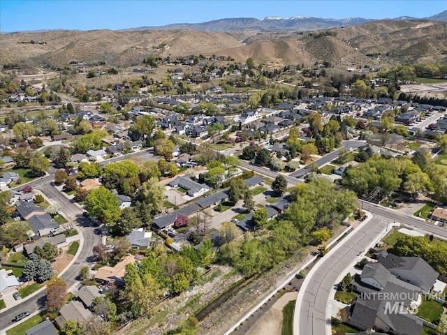 birds eye view of property with a residential view and a mountain view