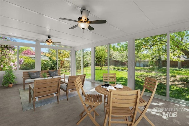 sunroom / solarium with an outdoor hangout area, a ceiling fan, and outdoor dining area