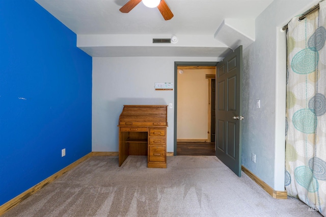 unfurnished bedroom featuring visible vents, baseboards, a ceiling fan, and carpet flooring