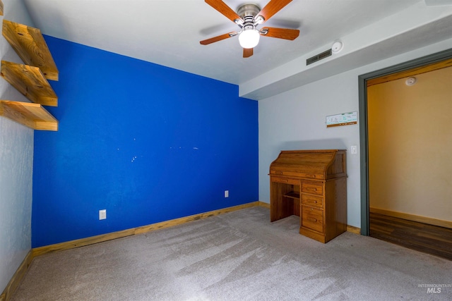 unfurnished bedroom featuring visible vents, baseboards, carpet floors, and ceiling fan