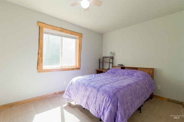 bedroom featuring carpet flooring, a ceiling fan, and baseboards