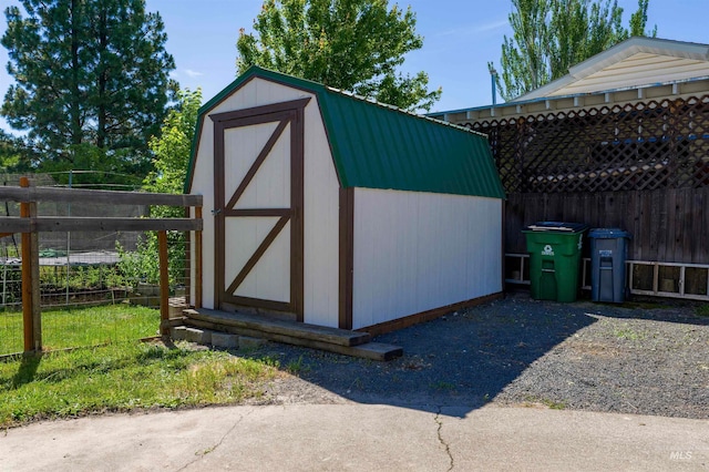 view of shed with fence
