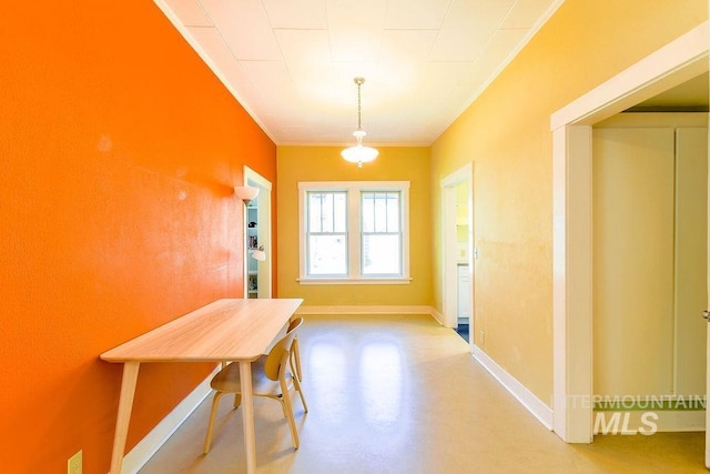 512 N Lincoln St, Moscow, ID 83843 - dining room with concrete floors, ornamental molding, and baseboards