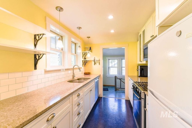 512 N Lincoln St, Moscow, ID 83843 - kitchen featuring white cabinets, open shelves, a sink, decorative backsplash, and appliances with stainless steel finishes