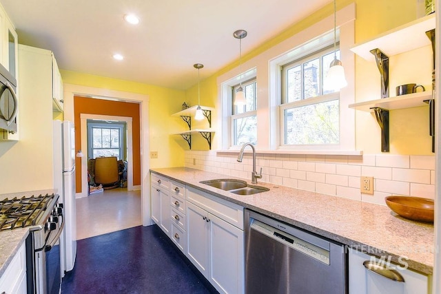512 N Lincoln St, Moscow, ID 83843 - kitchen featuring open shelves, stainless steel appliances, a sink, and tasteful backsplash