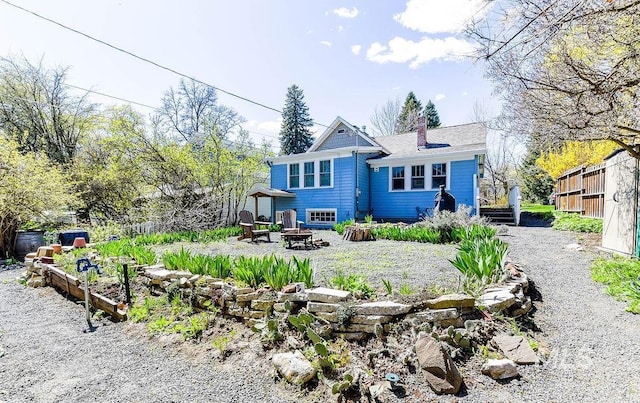 512 N Lincoln St, Moscow, ID 83843 - view of front of house with a fire pit and a chimney