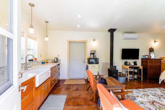 512 N Lincoln St, Moscow, ID 83843 - interior space featuring recessed lighting, a wood stove, and an AC wall unit