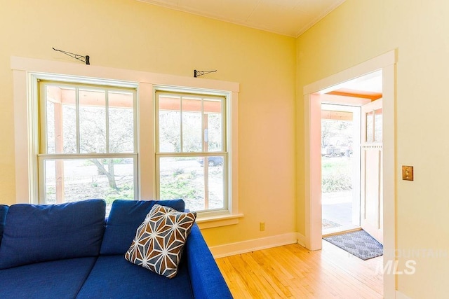 512 N Lincoln St, Moscow, ID 83843 - living area featuring light wood-style floors, crown molding, and baseboards