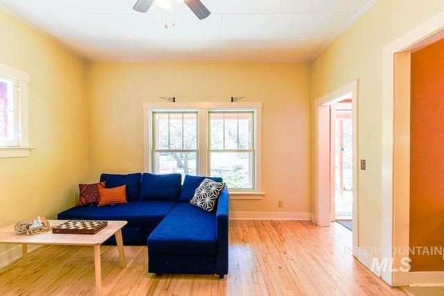 512 N Lincoln St, Moscow, ID 83843 - living room with crown molding, plenty of natural light, light wood finished floors, and a ceiling fan