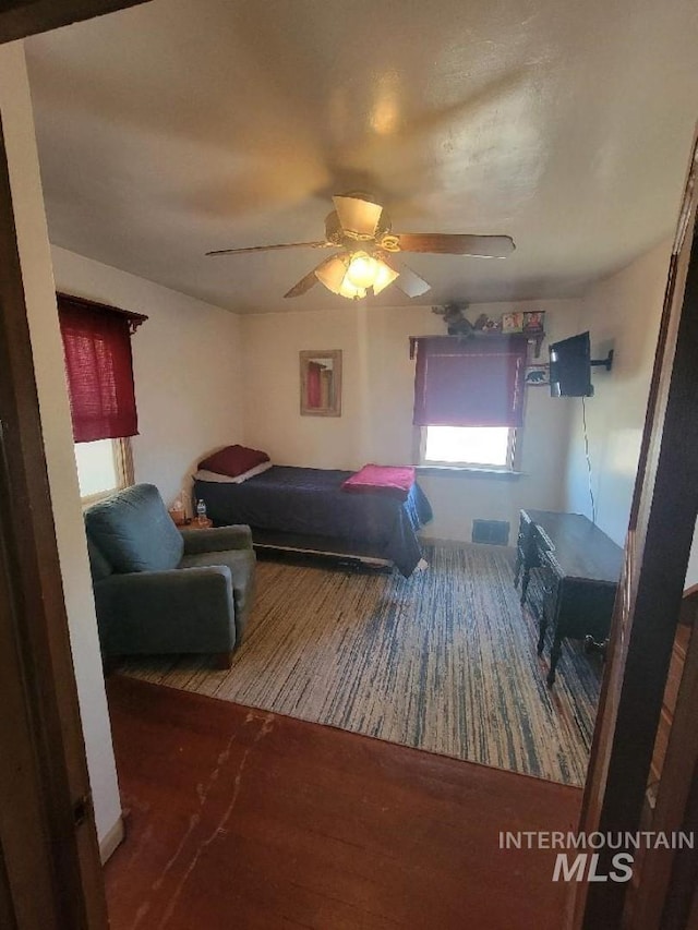 carpeted bedroom with ceiling fan