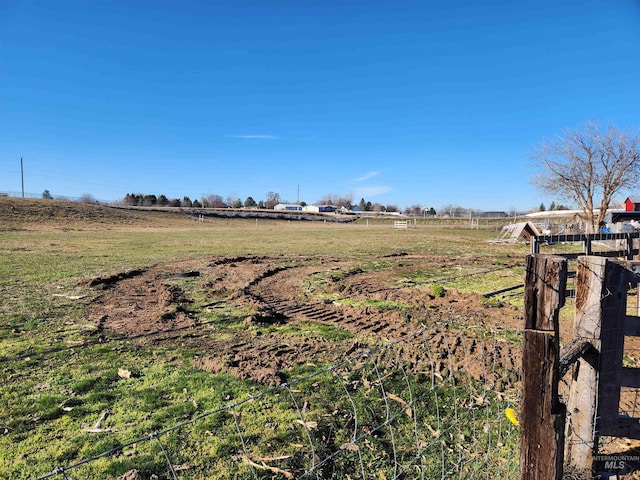 view of yard with a rural view