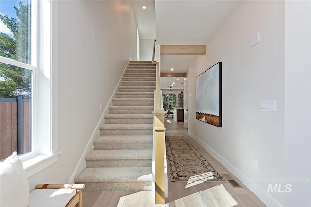 3892 W Stone House Ln, Eagle, ID 83616 - stairs featuring healthy amount of natural light, wood finished floors, baseboards, and recessed lighting
