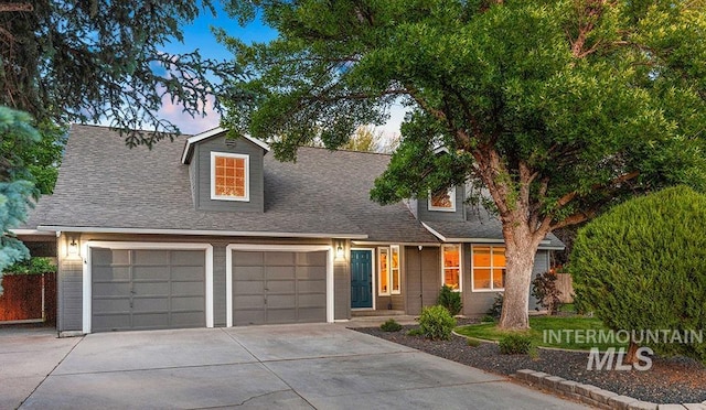 1866 S Goldking Way, Boise, ID 83709 - cape cod-style house with driveway, an attached garage, and roof with shingles
