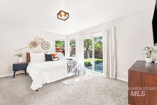 1866 S Goldking Way, Boise, ID 83709 - carpeted bedroom with access to exterior and baseboards