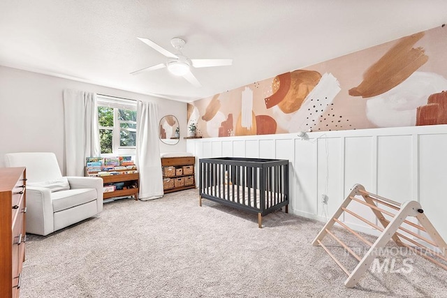 1866 S Goldking Way, Boise, ID 83709 - carpeted bedroom with a nursery area and a ceiling fan