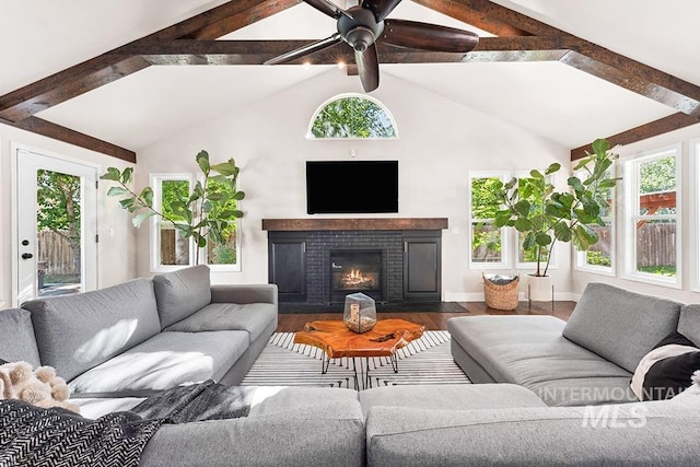 1866 S Goldking Way, Boise, ID 83709 - living room featuring healthy amount of natural light, wood finished floors, ceiling fan, and a brick fireplace
