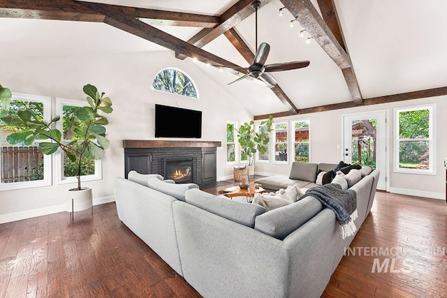 1866 S Goldking Way, Boise, ID 83709 - living room with a glass covered fireplace, baseboards, beamed ceiling, a ceiling fan, and dark wood-type flooring