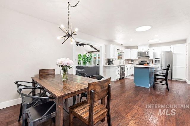 1866 S Goldking Way, Boise, ID 83709 - dining area with a chandelier, baseboards, dark wood-style flooring, recessed lighting, and wine cooler