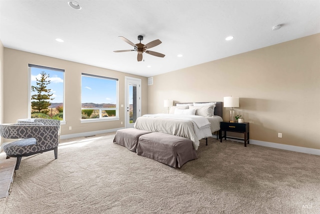 bedroom with ceiling fan and carpet floors