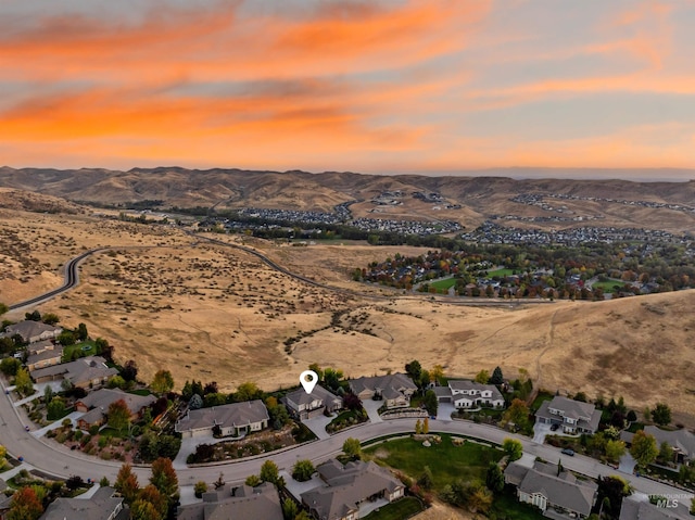 aerial view at dusk with a mountain view