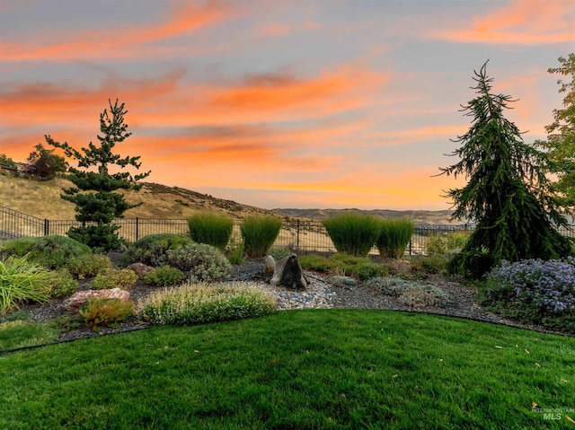 yard at dusk with a mountain view