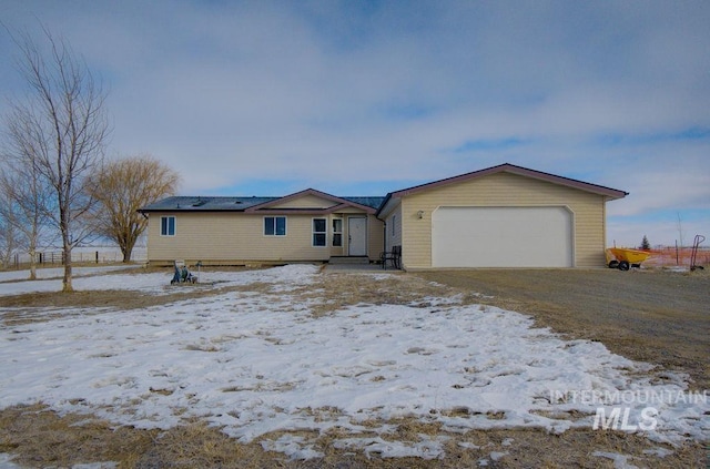 single story home with a garage