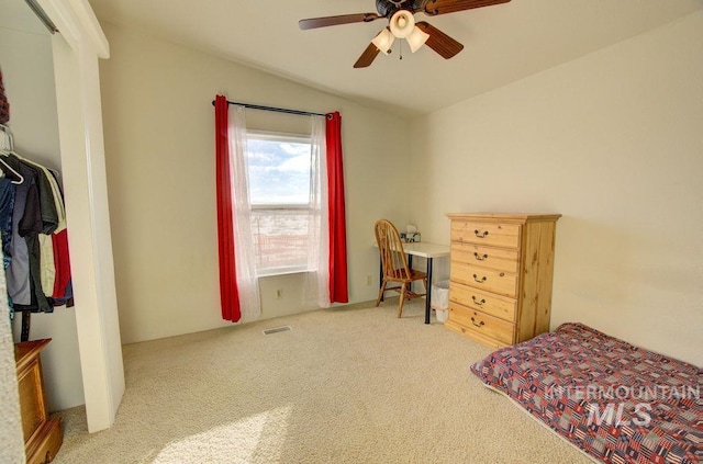 carpeted bedroom with lofted ceiling and ceiling fan