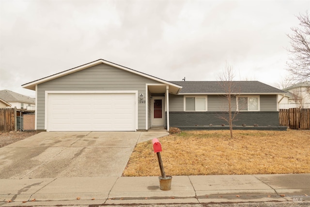 single story home with a garage, fence, concrete driveway, and brick siding