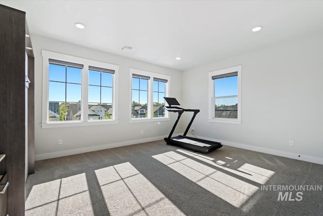 exercise area with carpet flooring, baseboards, and recessed lighting