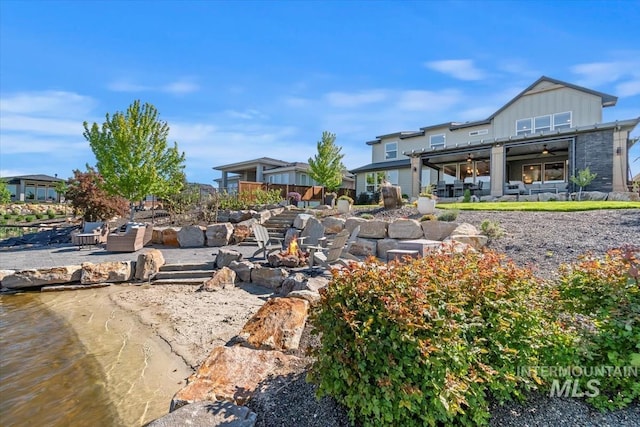 surrounding community with a fire pit and a patio