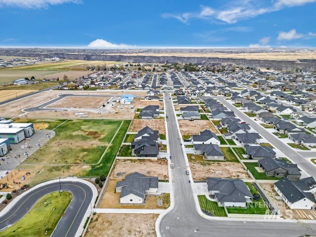 birds eye view of property with a residential view