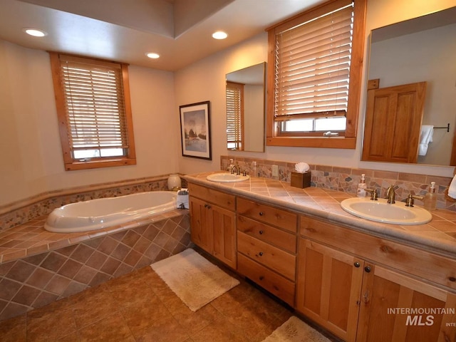 1319 Hearthstone Ct Unit 3-A, Mccall, ID 83638 - bathroom featuring a garden tub, recessed lighting, double vanity, plenty of natural light, and tile patterned flooring