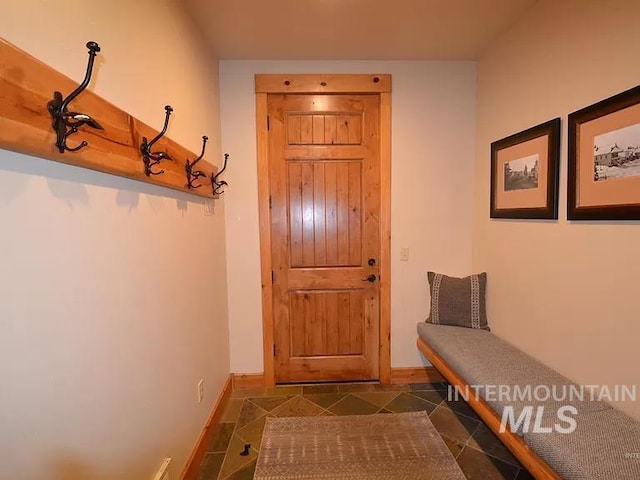 1319 Hearthstone Ct Unit 3-A, Mccall, ID 83638 - doorway featuring baseboards and dark tile patterned flooring