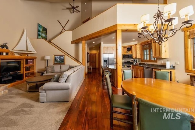 1319 Hearthstone Ct Unit 3-A, Mccall, ID 83638 - dining room with a chandelier, dark wood-type flooring, a towering ceiling, and ceiling fan