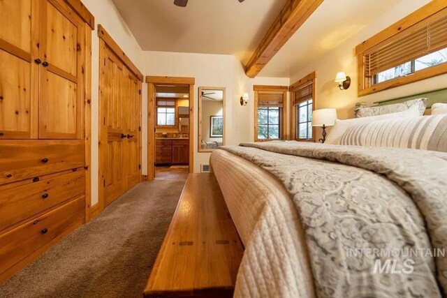 1319 Hearthstone Ct Unit 3-A, Mccall, ID 83638 - bedroom featuring beam ceiling, carpet flooring, ensuite bathroom, multiple closets, and a ceiling fan